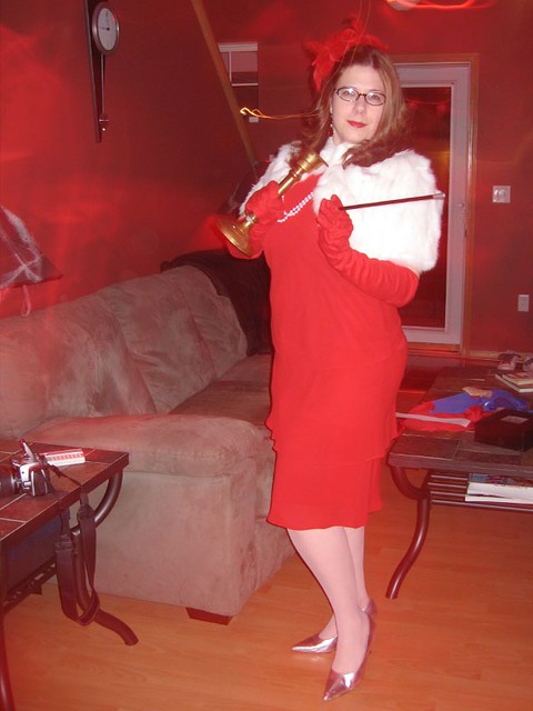 Miss Scarlet.  In the Living Room.  With the Candlestick.