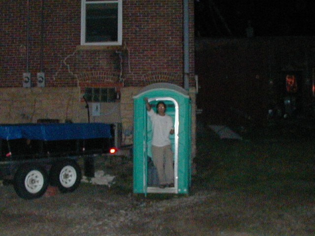 Tom in an outhouse