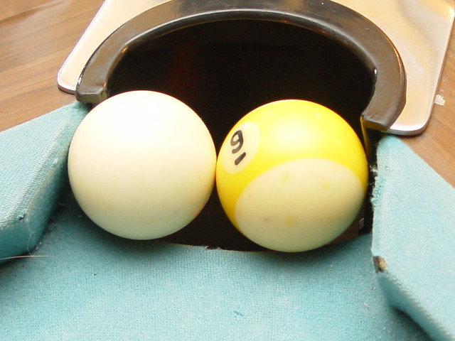2 pool balls stuck in the pocket