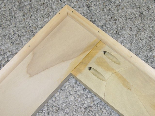 The corner of the frame.  You can see the pocket hole joining along with the quarter round along the edges which will ensure the screen never touches any of the frame except at the very edges.