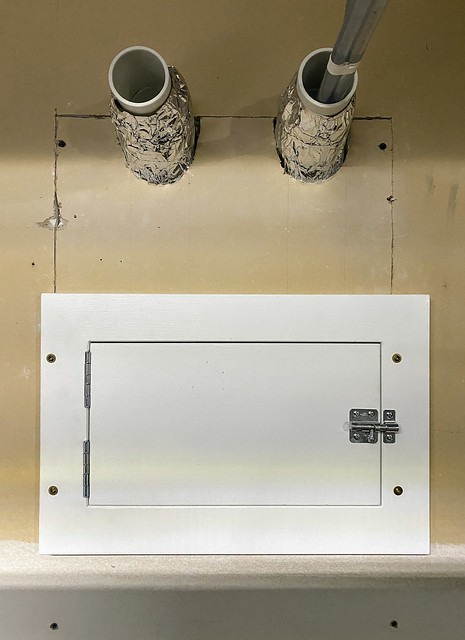 Wall patched up and tap box door installed