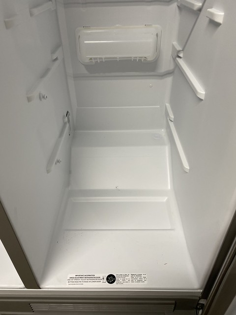 The part where the compressor sits didn't allow the kegs to sit deep enough for the door to close...