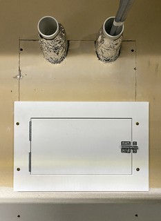 Wall patched up and tap box door installed