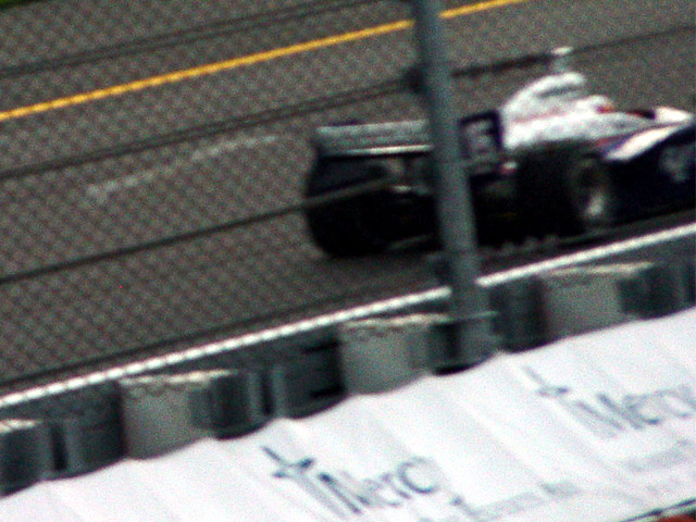 A huge/blurry vapor trail coming off the wing