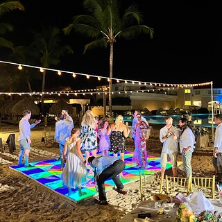 Wedding - Jake, wiping sand off the dance floor for Poppy