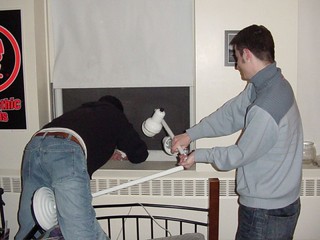 Putting Kevi's lamp out the window (Kevi was at Stacy's, whose dorm room can see our dorm room's ...