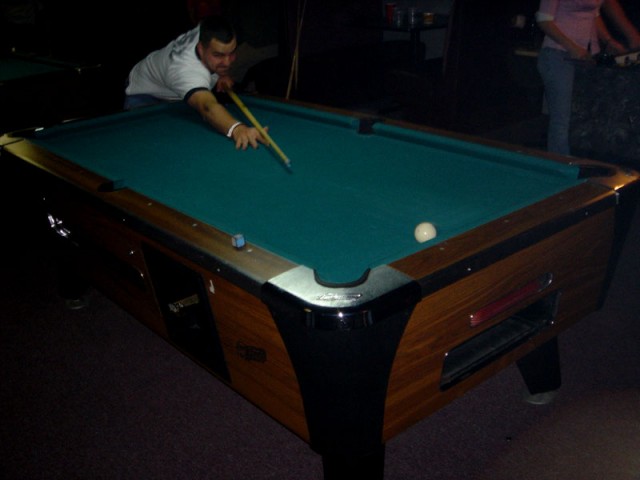 Chuck shooting pool