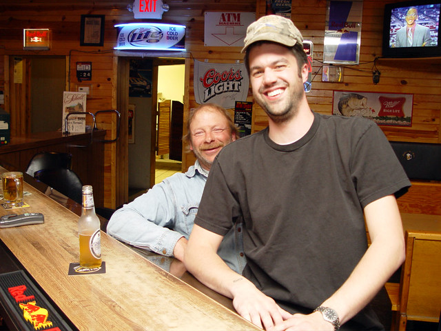14 - take a picture on a farmer's lap while wearing his cap, Danube, MN