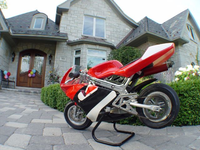 My pocket bike parked outside of Steph's