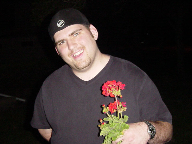 Kevi and some flowers he picked for Mary