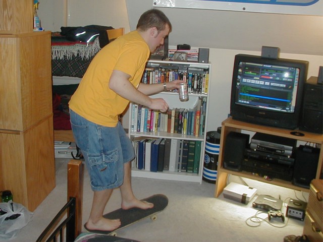 Josh trying to skate in my dorm