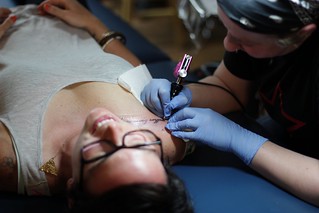 Tattoo - Kari gets her collar bone all tattered up