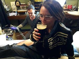 Tattoo - Enjoying a porter, mid tattoo