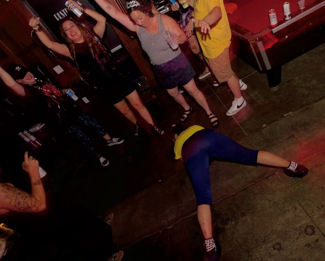 This woman was apparently a cook next door and just went bonkers on the dance floor after her shift was over