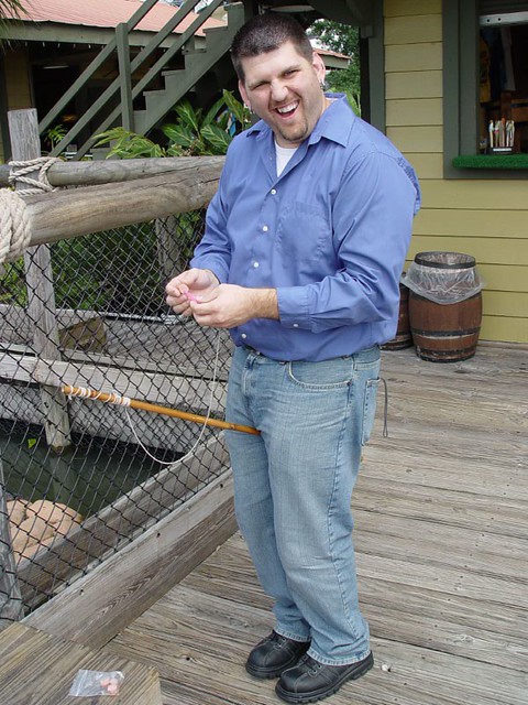 Kevi putting a hotdog on a string