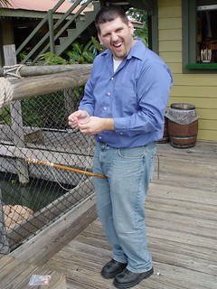 Kevi putting a hotdog on a string