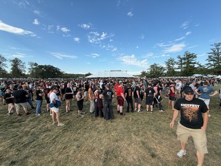 Shows - This is a merch line. It zig zags all the way up to that white tent, which is huge.