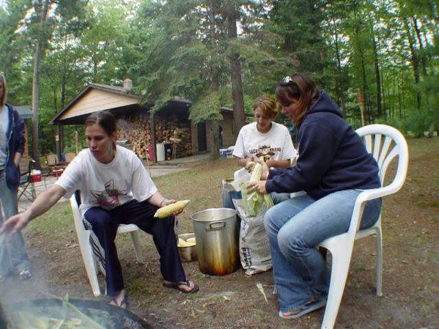 Girls cleaning the corn