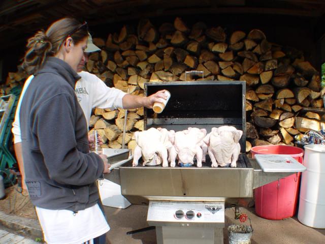 6 chickens with beer cans in their butts