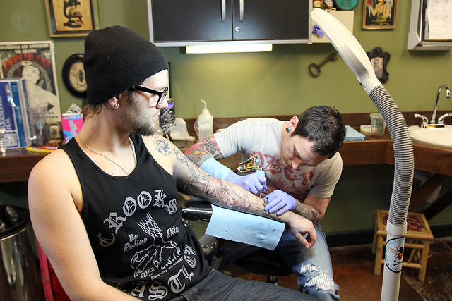 Getting tattooed by Joshua Bowers at Iron Heart Tattoo