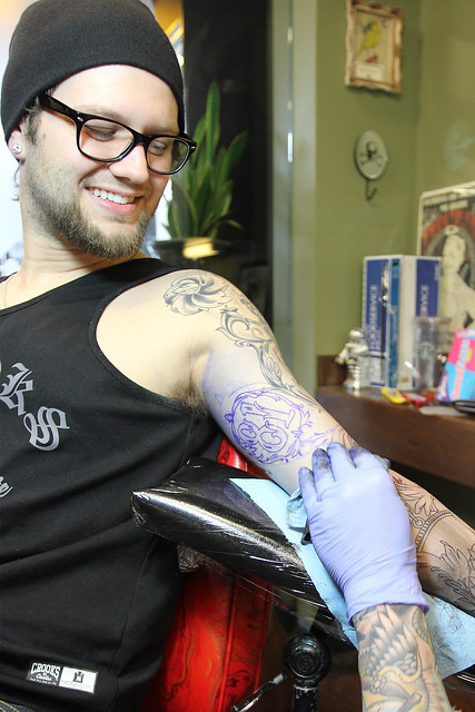 Getting tattooed by Joshua Bowers at Iron Heart Tattoo