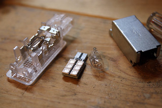 Tech - Comparison of 6-LED red wafer footwell lights and the stock incandescent footwell bulbs.