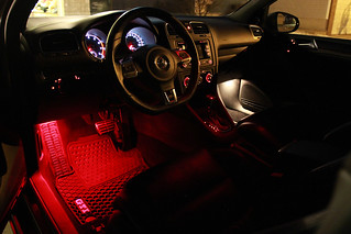 2011 VW GTI - Comparison of 6-LED red wafer footwell lights and the stock incandescent footwell bulbs.