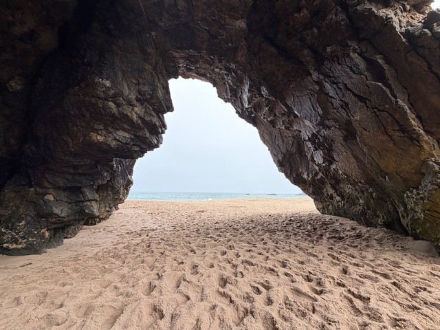 Adraga beach cave