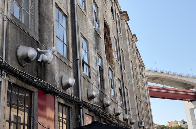 What is that baby doing on that building
