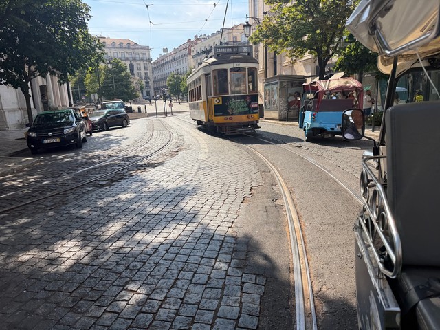 Racing trolleys, cars, bikes, and other tuk tuks
