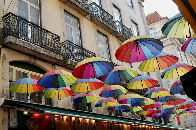 Umbrellas above pink street