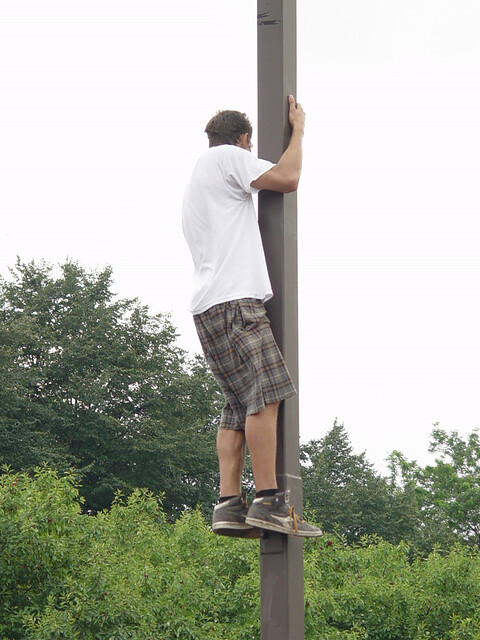 Dude watching Santigold from a post