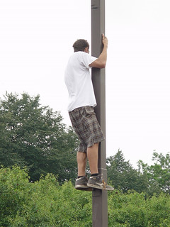 Lollapalooza - Dude watching Santigold from a post