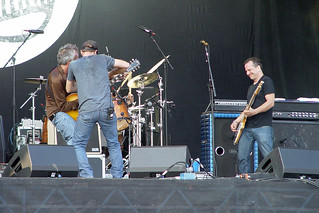 Lollapalooza - Still rocking while getting a broken guitar strap fixed