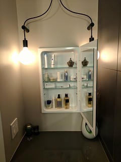 We crammed a lot of stuff into this bathroom. As such, we tried to squeeze storage into as many places as possible. A simple medicine cabinet at Kari's sit-down vanity.