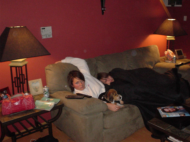 Girls laying down watching movies while Jeff cooks