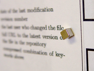 Red 5 - Closeup of a 1/8" Cube Magnet