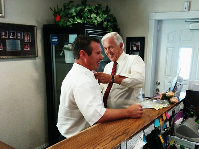 Gettin a boutineer from the limo driver.