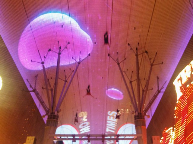 Zipliners flying through Fremont Street