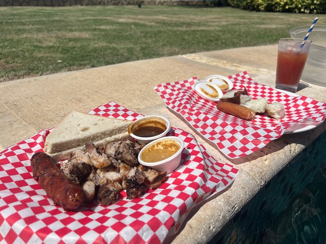 Jerk pork, sausage, hard dough bread, sweet potato, and jamaica festivals. Jamaica stuff