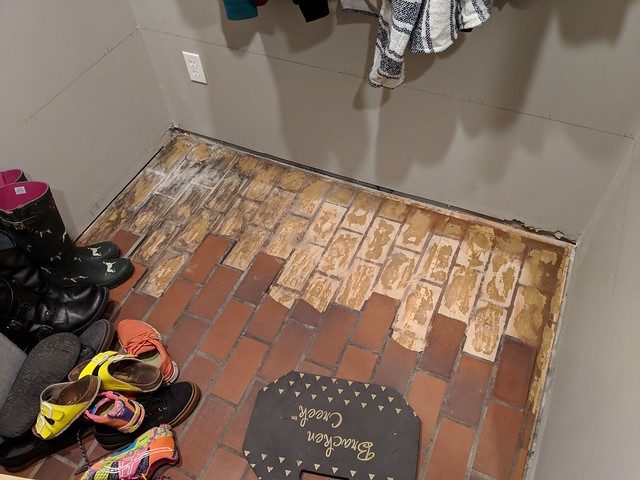 Pulling up the old, nasty tile.