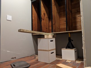 I used fulcrums and jack stands to raise the lockers up for the shoe cubbies to slide underneath