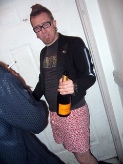 Travel - Harper with champagne, a noise maker, and no pants