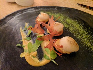 some crazy scallops with pureed cauliflower and crispy, beet died cauliflower slices