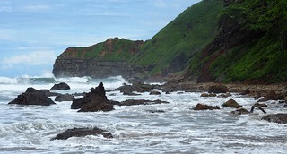 Some waves crashing on rocks at the end of our beach