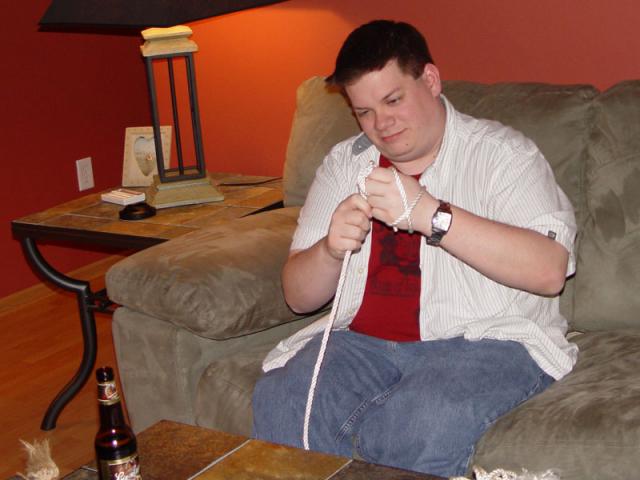 Nick trying to figure out how to tie knots