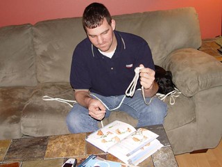 Chuck McGrane - Chuck tying a knot while ninja sleeps