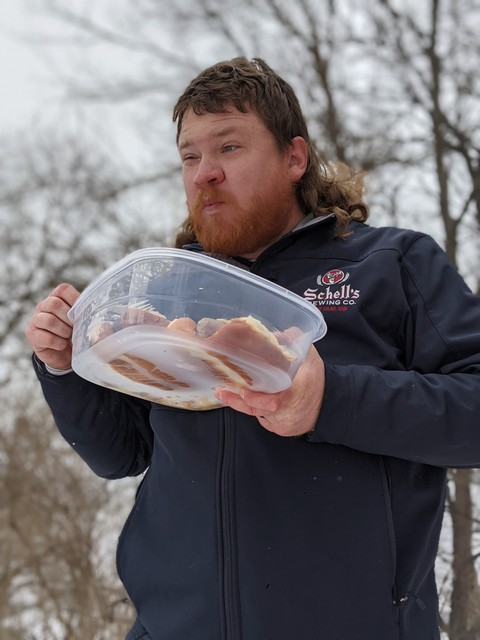 Mullet man enjoys brats and kraut