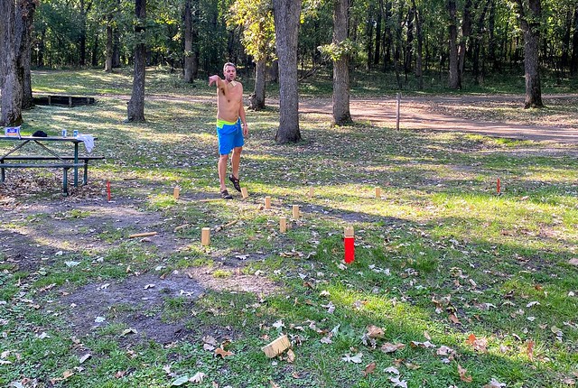 Josh teaching us how to play kubb