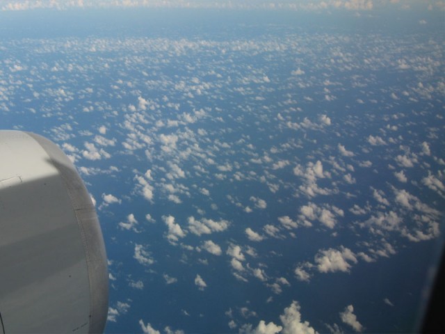 Flying over the Caribbean - The clouds were weird... maybe the circular lines were leftover from the edge of the hurricane?